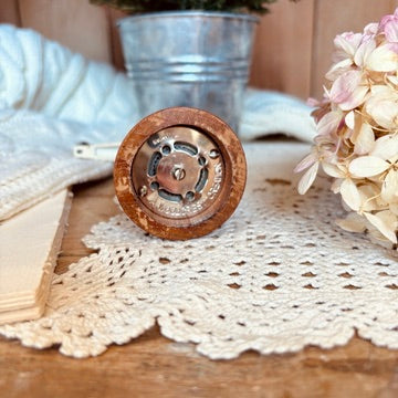 Wood and brass pepper shaker