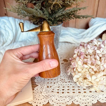 Wood and brass pepper shaker