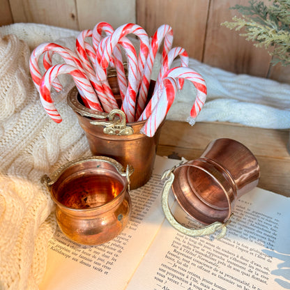 Trio of copper pots