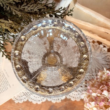 Floating glass and brass vase