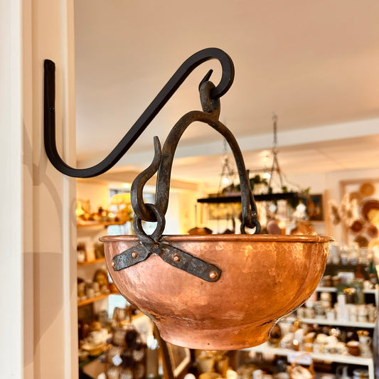 Hanging hammered copper cauldron
