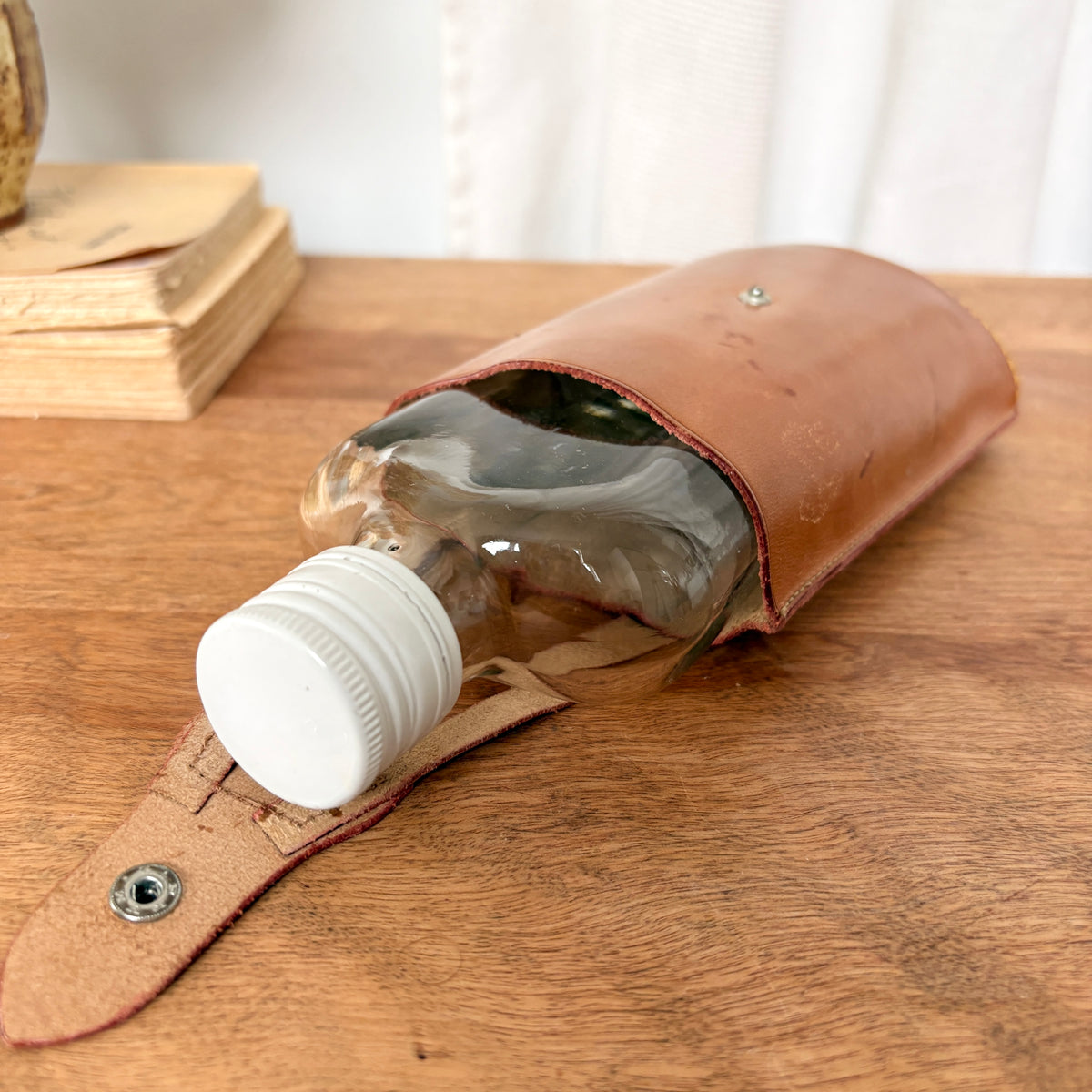 Bouteille dans son étui